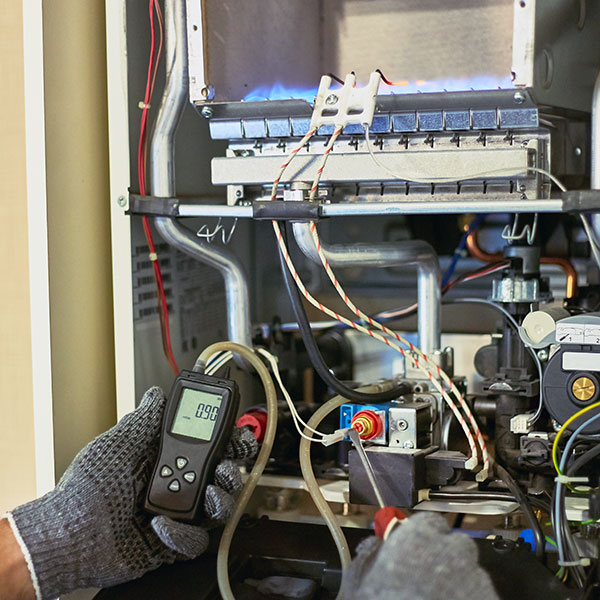 hvac technician using tools